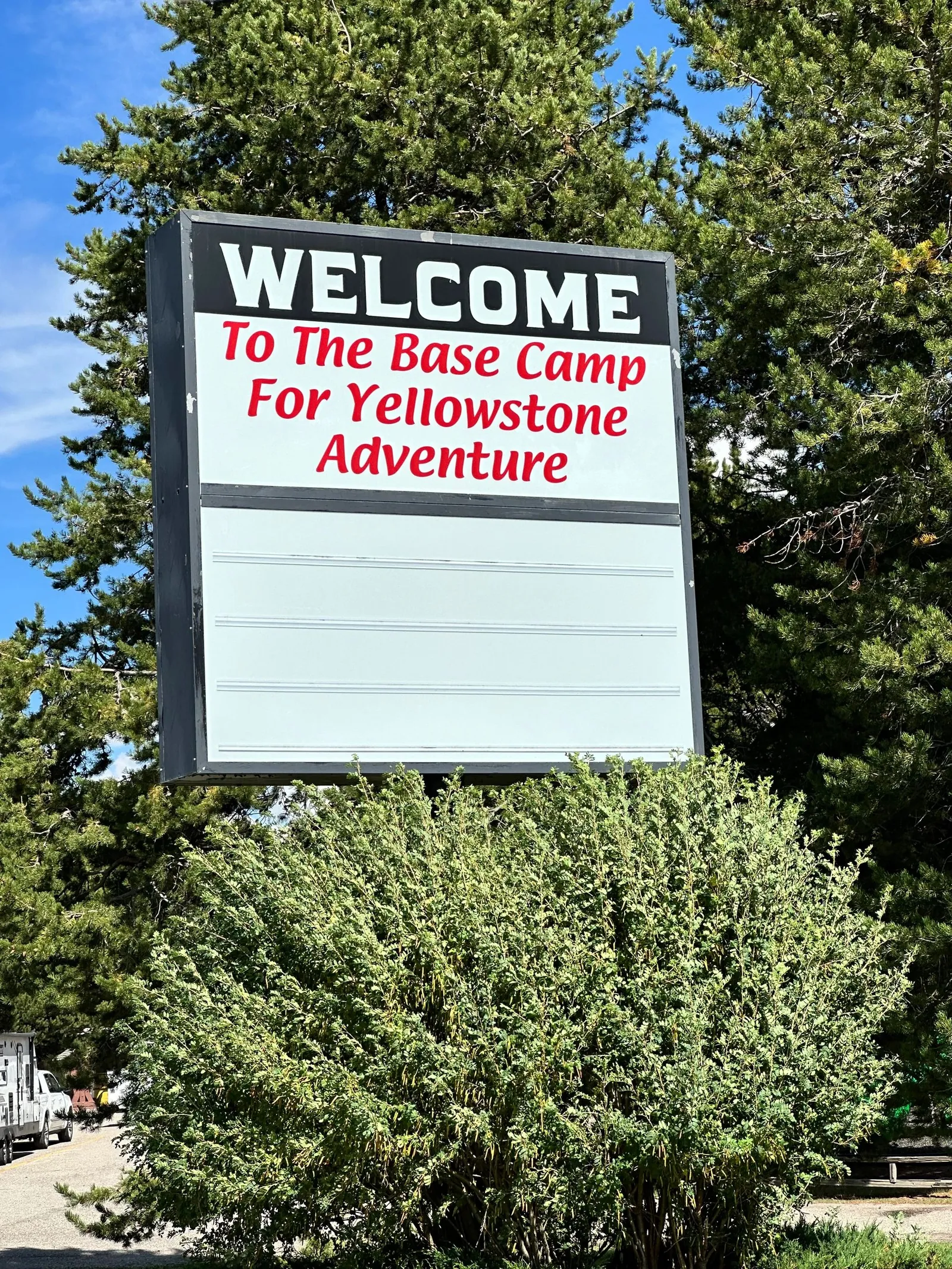 Welcome sign for a Yellowstone adventure base camp