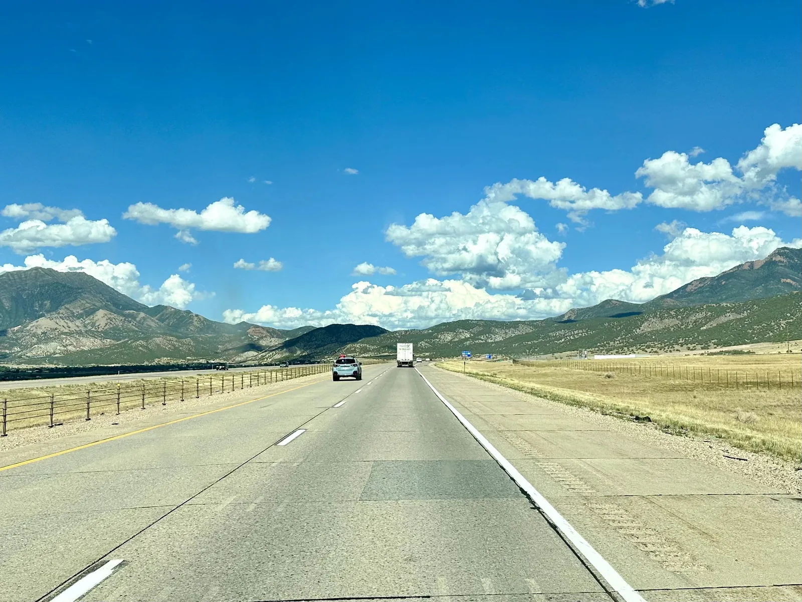 Western highway through wide-open mountains